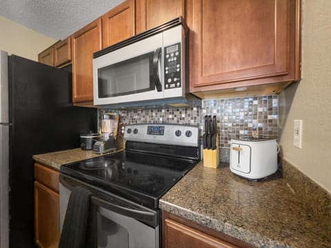 Kitchen or kitchenette, dishwasher, stove, toaster