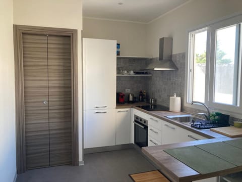 Kitchen or kitchenette, dishwasher, oven, stove
