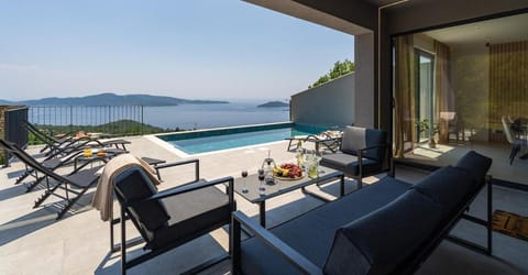 Patio, Day, View (from property/room), Seating area, Sea view, Swimming pool, Swimming pool, sunbed
