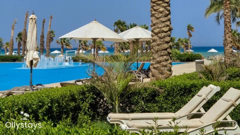 Property building, Property logo or sign, Pool view, Sea view, sunbed