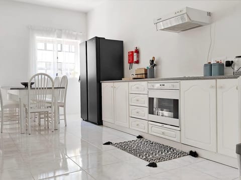 Kitchen or kitchenette, Seating area, Dining area, oven, stove, air conditioner