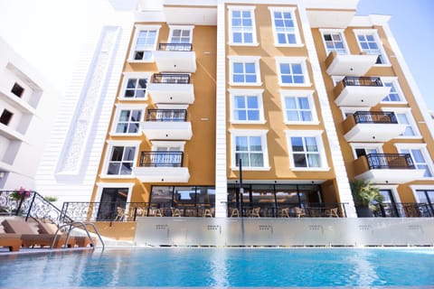 Property building, Day, Pool view, Swimming pool, sunbed