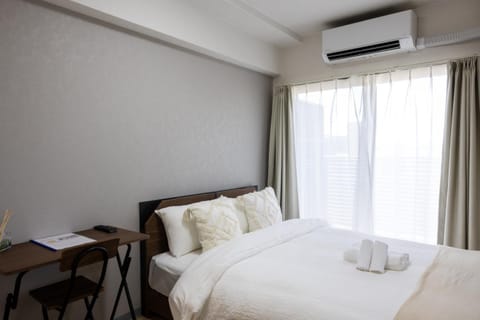 Bed, Photo of the whole room, Bedroom, towels, air conditioner