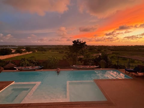 View (from property/room), Landmark view, Swimming pool, Sunset