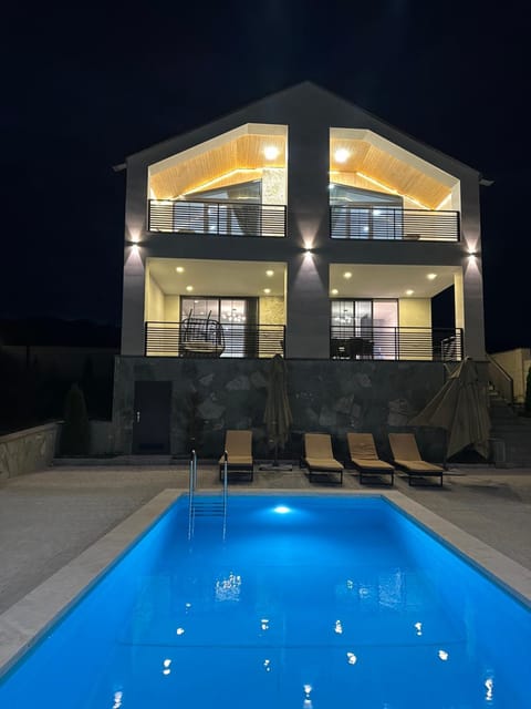 Property building, Night, Pool view, Swimming pool, sunbed
