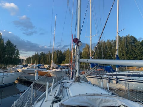Accommodation on a sailboat in Sysmä harbour Docked boat in Finland