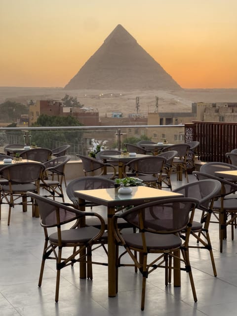 Property building, Nearby landmark, Restaurant/places to eat, Day, Natural landscape, Mountain view, Sunrise, Sunset