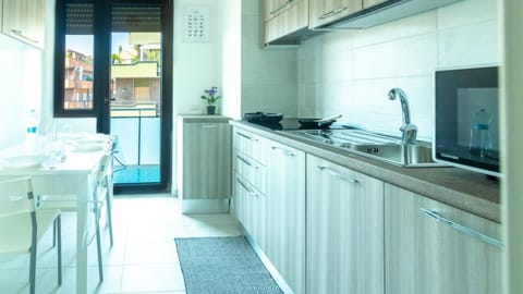 Kitchen or kitchenette, Photo of the whole room, Dining area, dishwasher, microwave, laundry