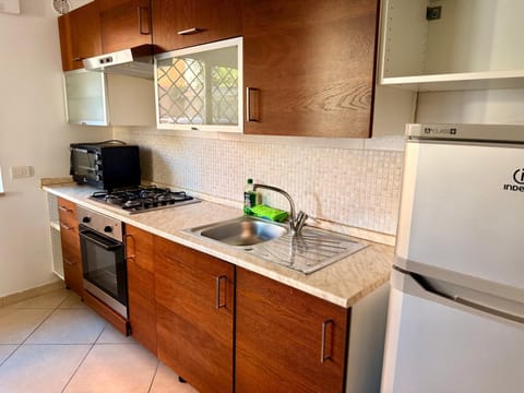 Kitchen or kitchenette, oven, stove
