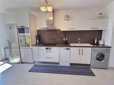 Kitchen or kitchenette, dishwasher, oven, stove, washing machine, dryer