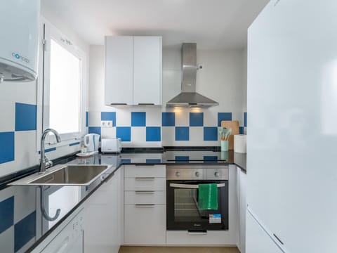 Kitchen or kitchenette, dishwasher, oven, stove, toaster