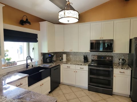 Kitchen or kitchenette, dishwasher, oven, stove, toaster