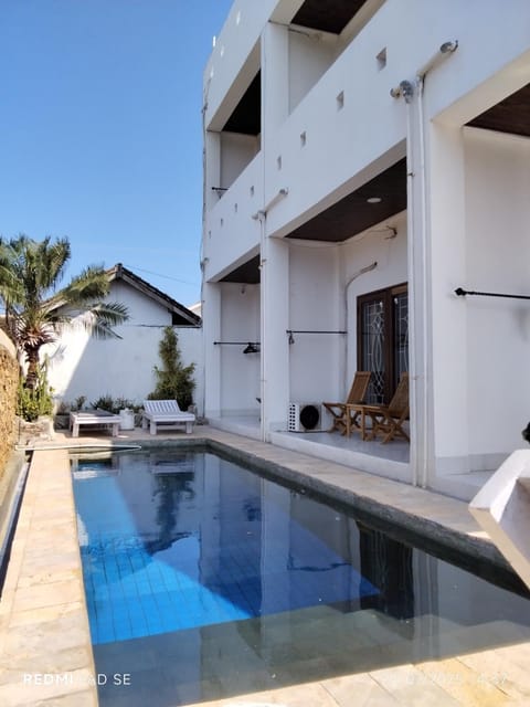 Property building, Patio, Day, Pool view, Swimming pool