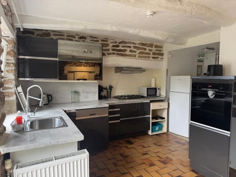 Kitchen or kitchenette, dishwasher, oven, stove, toaster