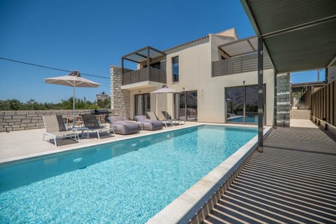 Property building, Patio, Pool view, Swimming pool, sunbed