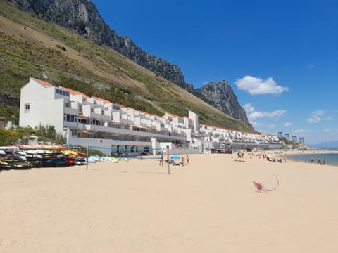 Property building, Natural landscape, Beach, Mountain view