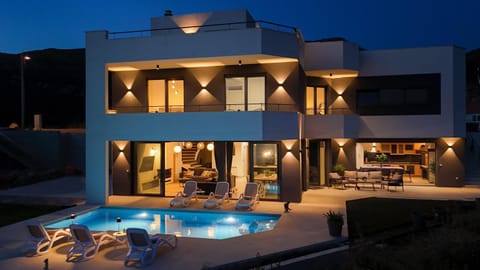 Property building, Patio, Night, Balcony/Terrace, Pool view, Swimming pool, sunbed