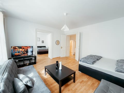 Bed, TV and multimedia, Living room, Seating area, Bedroom