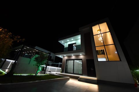 Property building, Patio, Night, Pool view, Swimming pool
