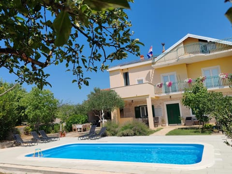 Property building, Patio, Day, Garden, Pool view, Swimming pool