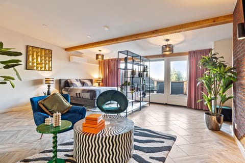 Bed, Living room, Seating area, Bedroom