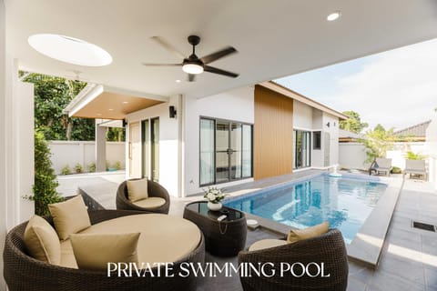 Natural landscape, Seating area, Text overlay, Pool view, Swimming pool