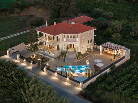 Property building, Facade/entrance, Night, Bird's eye view, Pool view, Swimming pool, Parking