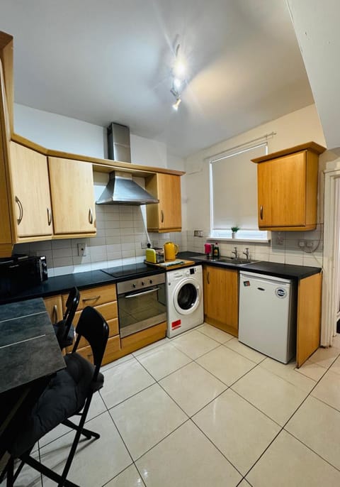 Kitchen or kitchenette, Seating area, Dining area, oven, stove, washing machine