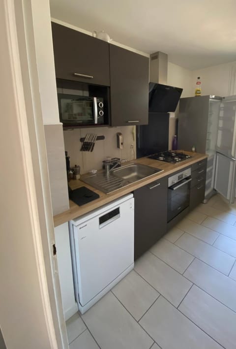 Kitchen or kitchenette, dishwasher, oven, stove, toaster