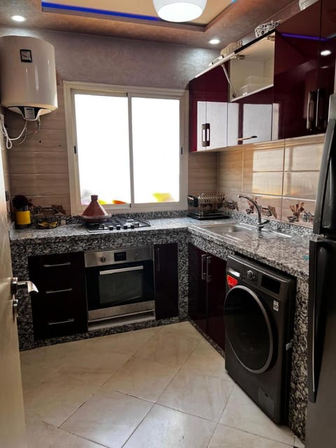 Kitchen or kitchenette, stove, washing machine