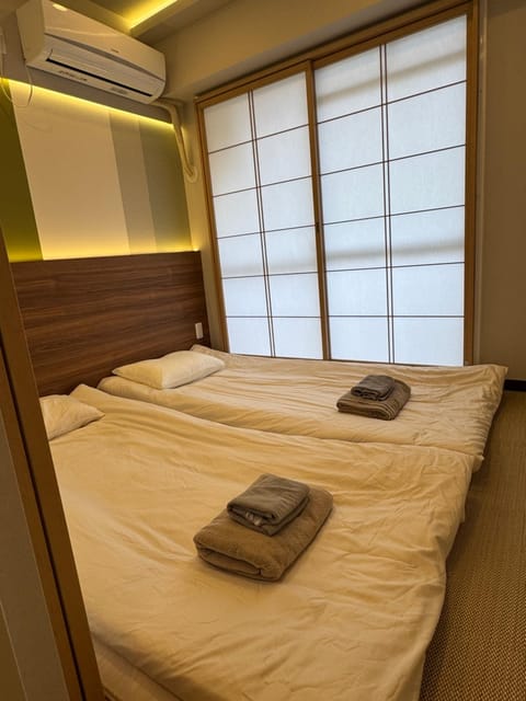Bed, Photo of the whole room, Bedroom, towels, air conditioner