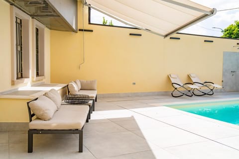 Patio, Seating area, Pool view, Swimming pool, sunbed