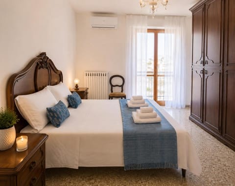 Bed, Bedroom, towels, wardrobe, air conditioner