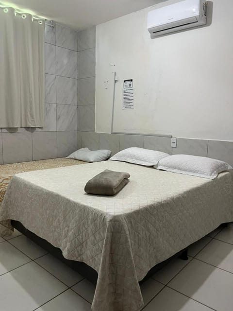 Bed, Photo of the whole room, Bedroom, towels, air conditioner