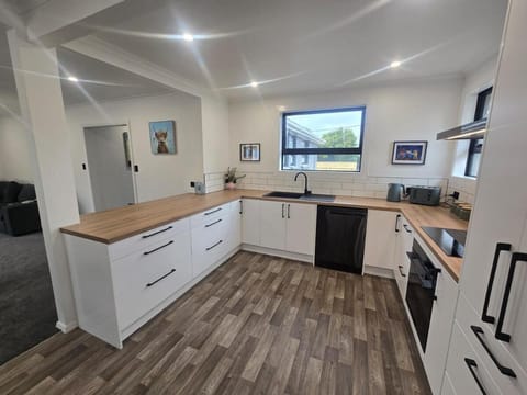 Kitchen or kitchenette, dishwasher, oven, stove