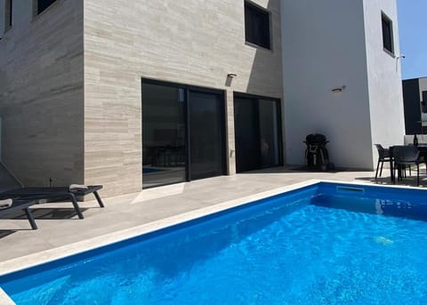 Property building, Patio, Day, Pool view, sunbed