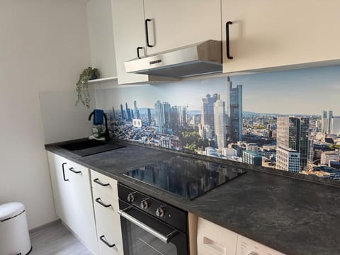 Kitchen or kitchenette, dishwasher, oven, stove