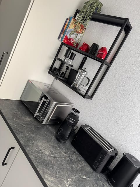 Kitchen or kitchenette, stove, toaster