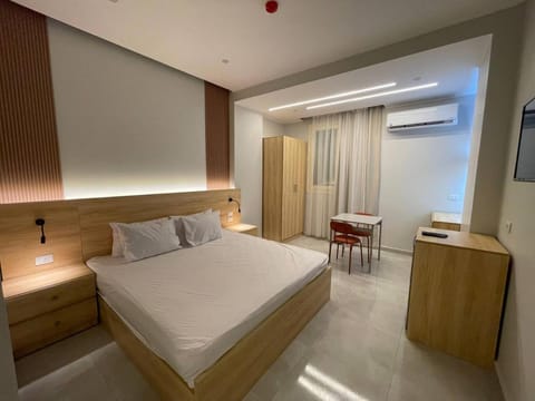 Bed, TV and multimedia, Living room, Photo of the whole room, Seating area, Bedroom, wardrobe, air conditioner