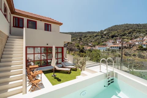 Property building, Patio, View (from property/room), Balcony/Terrace, Mountain view, Pool view, Swimming pool, sunbed