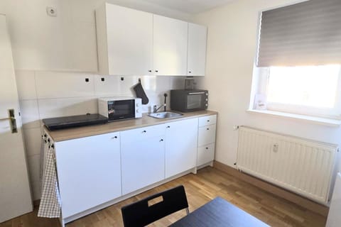 Kitchen or kitchenette, oven, stove, toaster