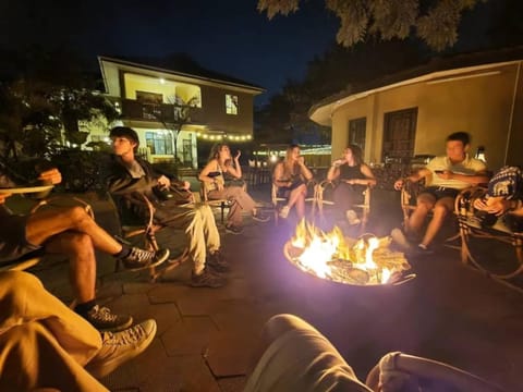 Patio, Night, BBQ facilities, group of guests