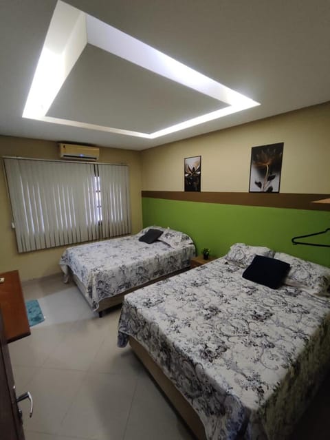 Photo of the whole room, towels, air conditioner