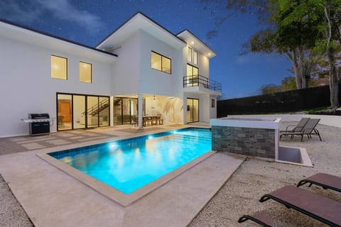 Property building, Patio, Night, Pool view, Swimming pool