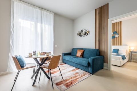 Bed, Living room, Seating area, Dining area