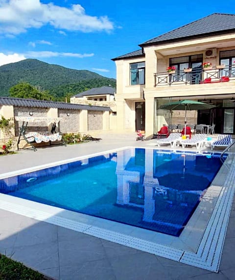 Property building, Patio, Day, Natural landscape, Mountain view, Pool view, Swimming pool, sunbed