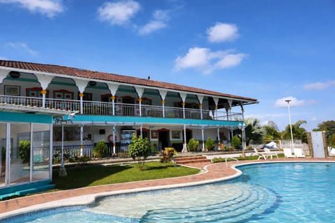 Property building, Nearby landmark, Day, Natural landscape, Summer, Pool view, Swimming pool, sunbed