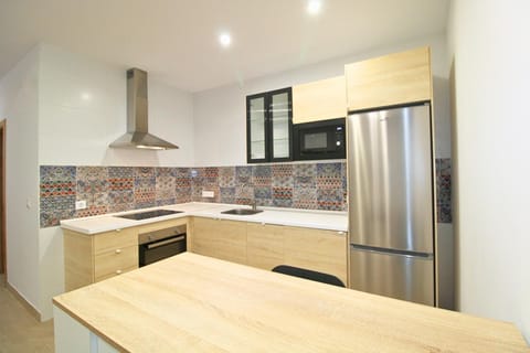 Kitchen or kitchenette, dishwasher, oven, stove