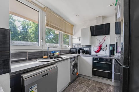 Kitchen or kitchenette, dishwasher, oven, stove, washing machine, dryer