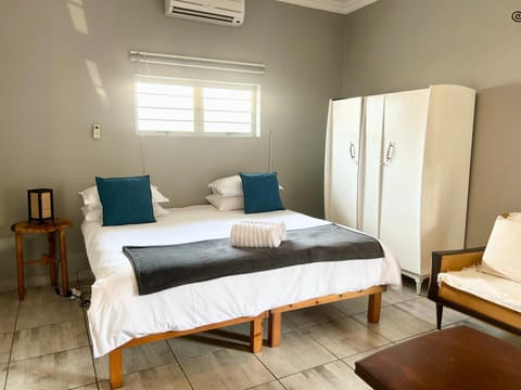 Photo of the whole room, Bedroom, towels, wardrobe, air conditioner